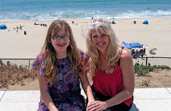 Karen Frantz with her daughter at the beach