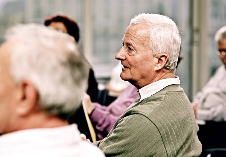 Elderly man participating in a support group