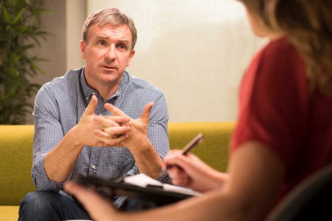 Man in a counseling session