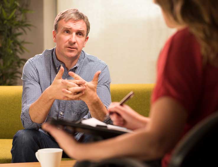 Man in a counseling session Man in a counseling session