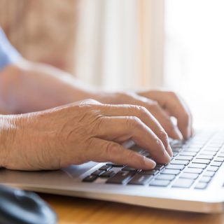 Man typing on keyboard