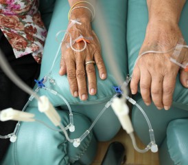 Patient's hands with IV tubes