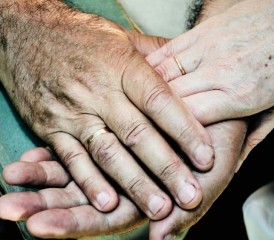 Married couple holding hands