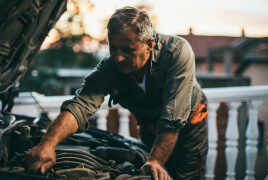 Man working on a car engine