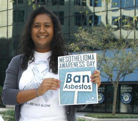 Nadia Persaud Holds Mesothelioma Awareness Day sign