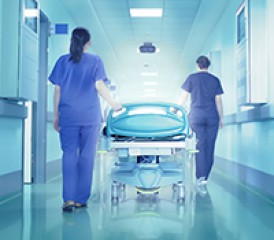 Hospital corridor with staff