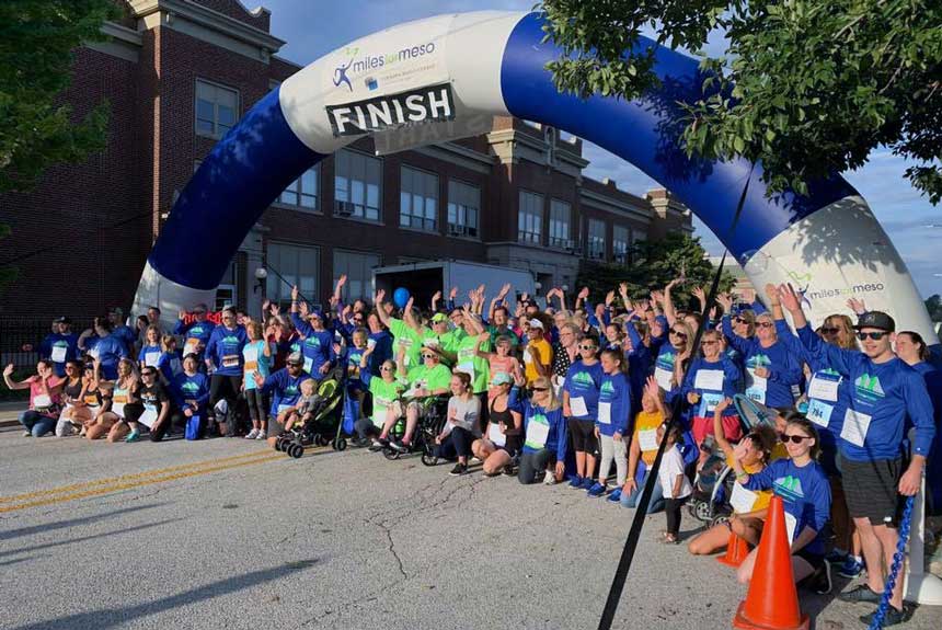 Miles for Meso finish line with survivors and their loved ones.