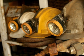 Dirty miners hard hats with light