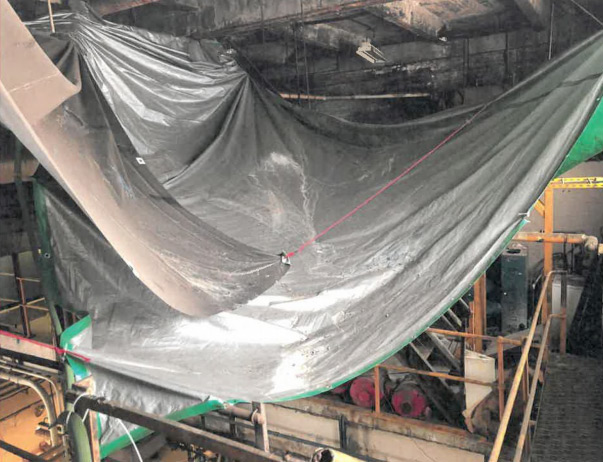 Tarp to catch asbestos debris at 207th St. Train Yard