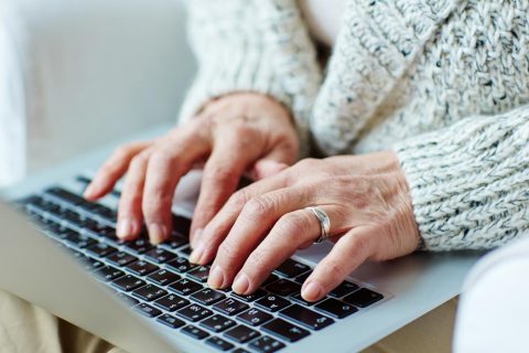 Woman typing on a laptop
