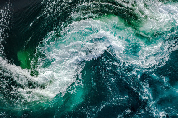 Swirling ocean water with whitecaps