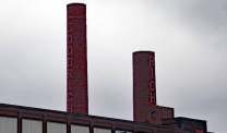 Rubber factory with smokestacks