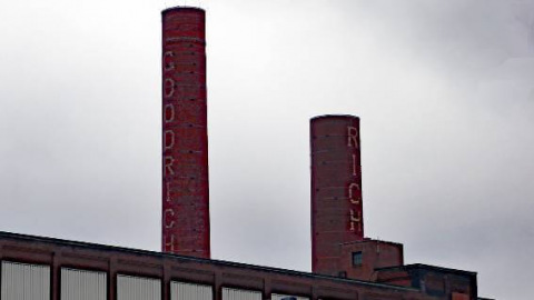 Rubber factory with smokestacks