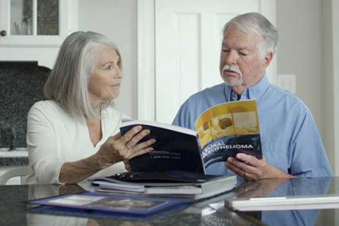 older couple reviewing mesothelioma packet