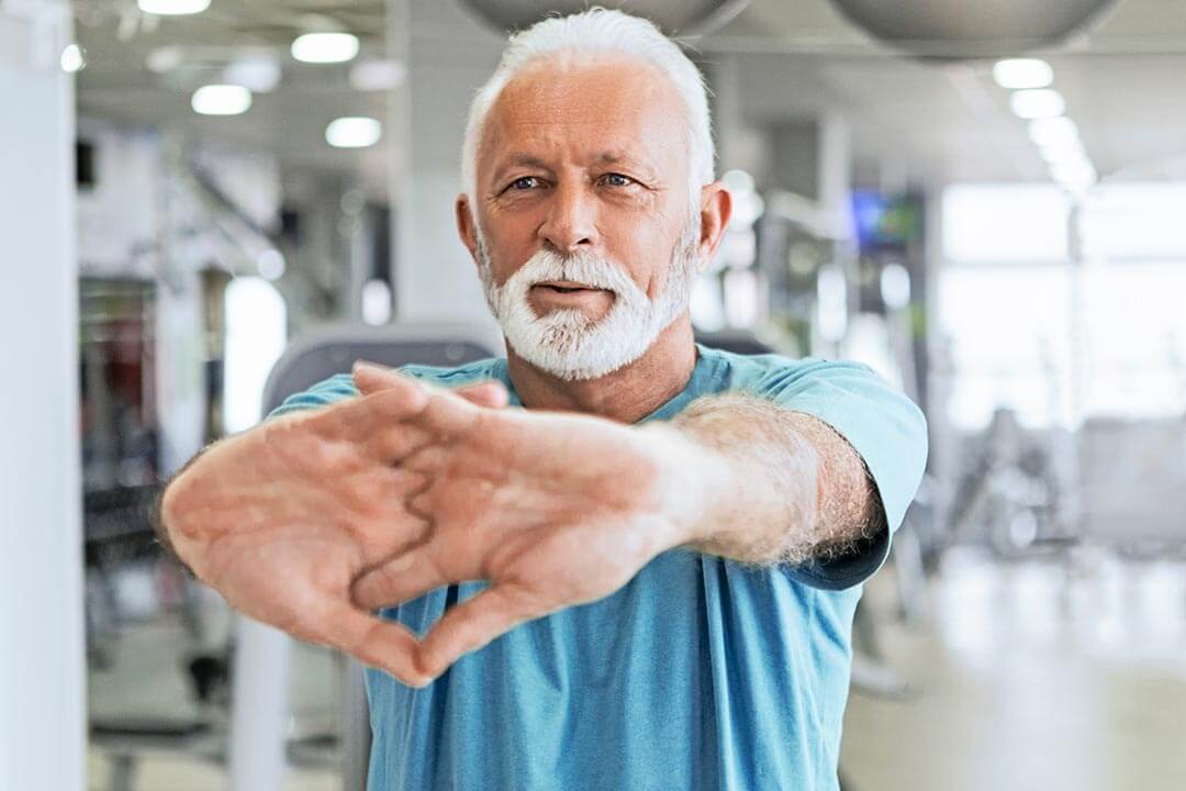 Older man stretching before exercise