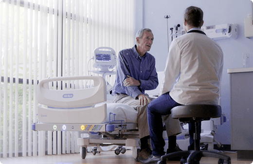 patient speaking with their doctor in the hospital