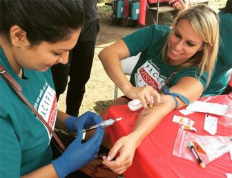 Woman donates blood at a Pacific Heart, Lung & Blood Institute walk