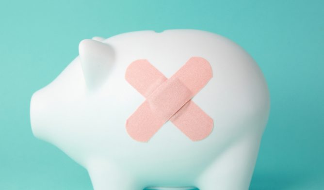 Piggy bank with band aid