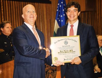 Dr. Raja Flores with New York City Police Commissioner James O’Neill