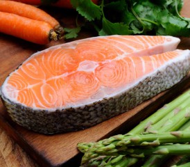 Salmon steak on a wooden board