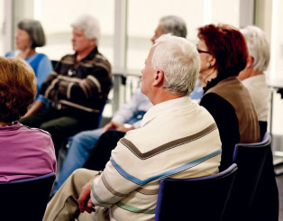 Older man at a support group meeting