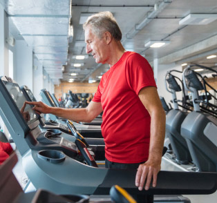 Senior on treadmill at the gym