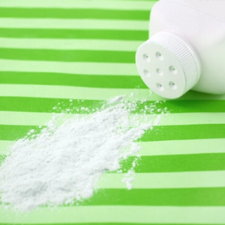 Spilled talc on green striped background