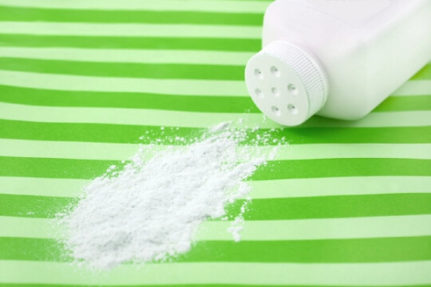 Spilled talc on green striped background