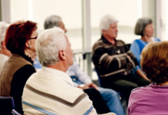 Elder people sitting in a support group meeting