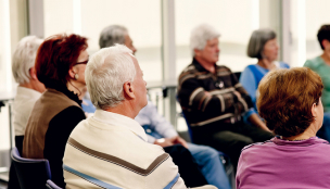 Elder people sitting in a support group meeting