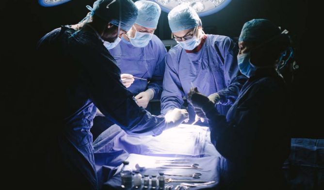 Surgeons performing surgery