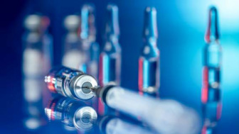 Syringe and vials of immunotherapy drugs