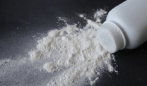 White talcum powder on black background