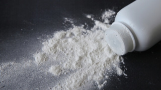 White talcum powder on black background
