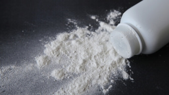 White talcum powder on a black background