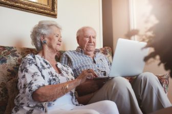 Elderly couple using a laptop