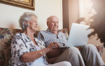 Elderly couple using a laptop