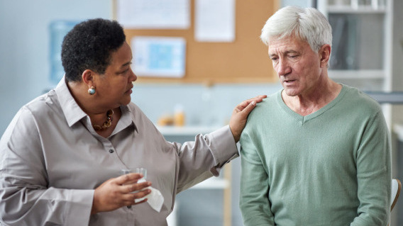 Therapist helping a patient