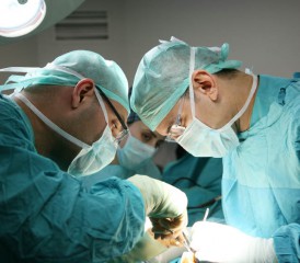 Two Doctors Performing Surgery