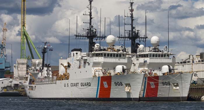 Two Coast Guard vessels tied up at the Portsmouth, NH Shipyard.