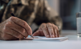 a veteran fills out paperwork