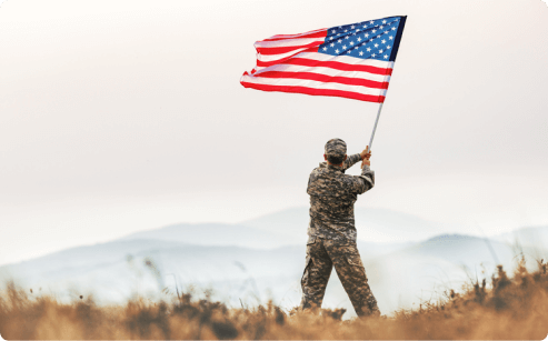 Veteran waving American flag