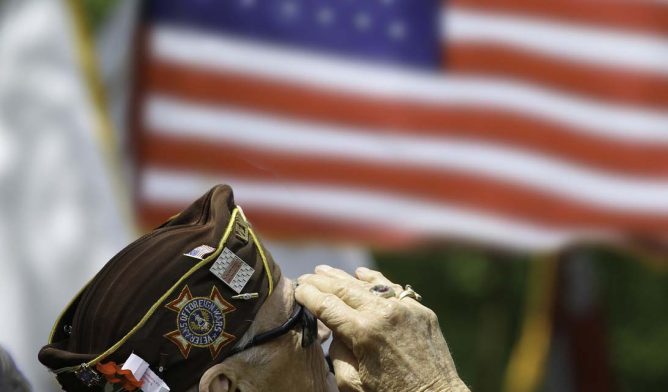 Veteran Salutes the US Flag