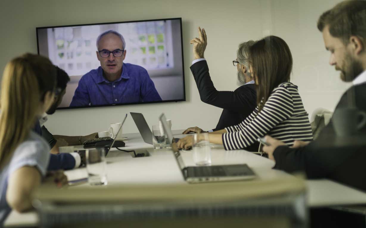 Lawyers virtually meeting with client