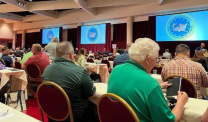 Conference attendees at tables