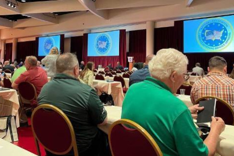 Conference attendees at tables