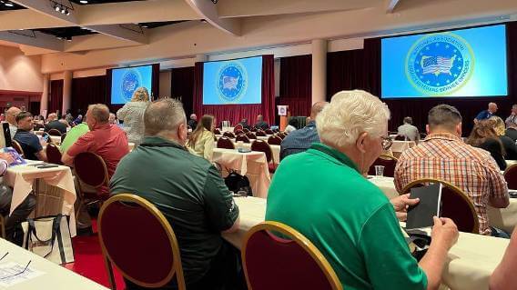 Conference attendees at tables