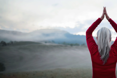 Woman doing yoga pose in nature.