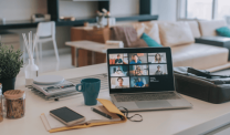 Laptop with screen video conference on kitchen counter