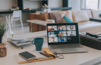 Laptop with screen video conference on kitchen counter